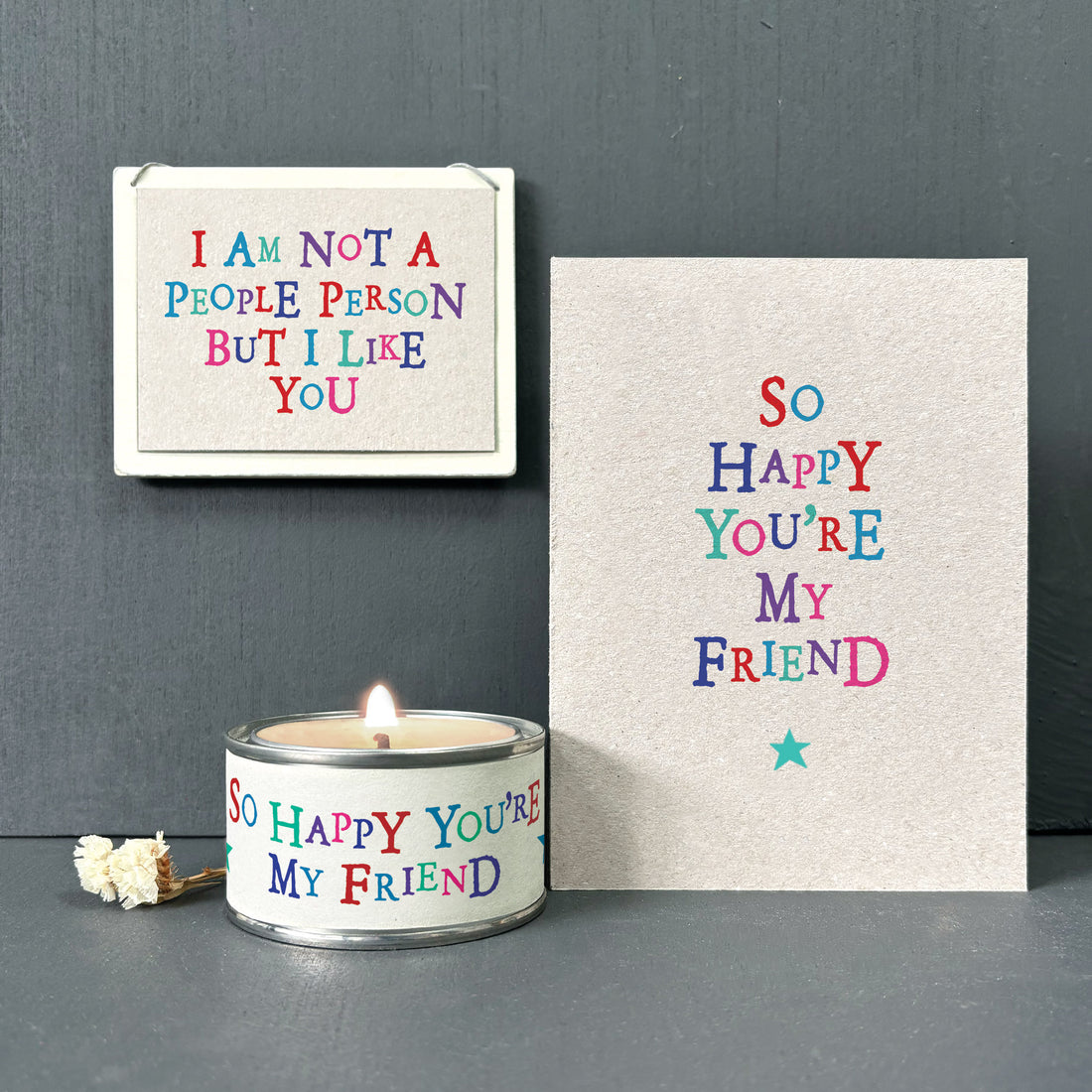 Scented Candle In Tin 'So Happy You're My Friend' Apple Blossom  Fragrance East Of India Wonky Word Candle