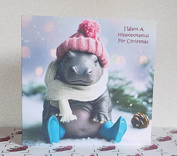 Hippo Christmas Card ' I Want A Hippopotamus' for Christmas Baby Hippo Wearing Pink Bobble Hat And Blue Wellies With Glitter Free Delivery