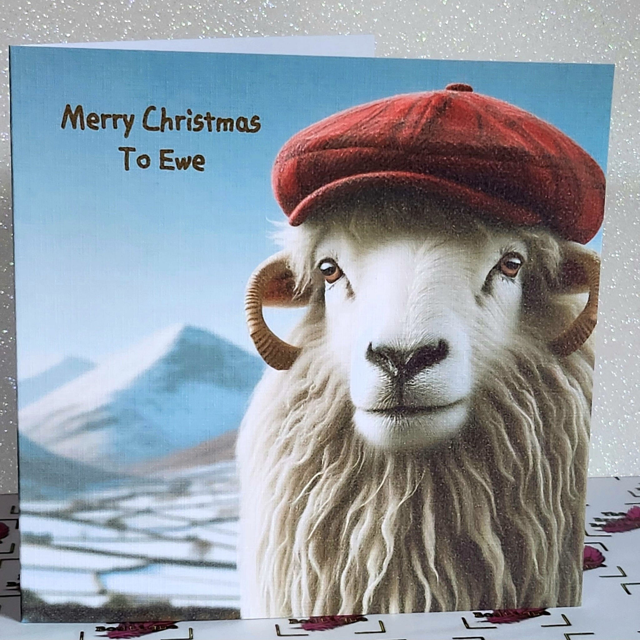 Christmas Sheep Card Handmade 'Merry Christmas To Ewe' Red Flat Cap In The Snow White Linen Effect Square Card Free Delivery