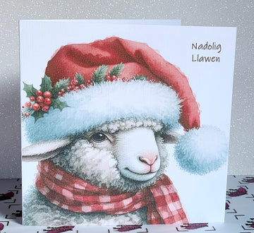 Nadolig Llawen Sheep Christmas Card Welsh Language Merry Christmas Sheep In Santa Hat With Holly And Scarf Linen Effect Free Delivery