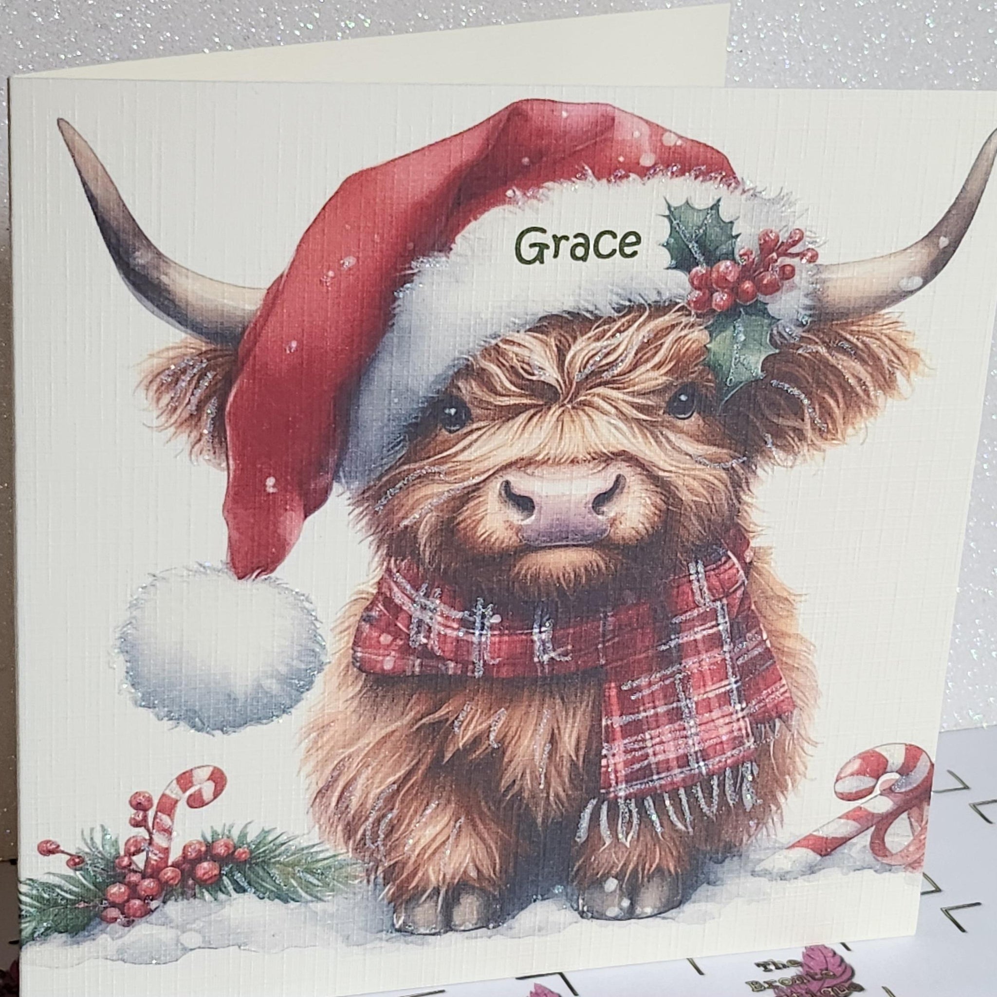 Highland Cow Christmas Card Highland Coo With Santa Hat Scarf And Holly Personalised Handmade Glitter Ivory Linen Effect  Free Delivery